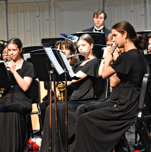 Senior Neela Myers and sophomore Haylee Majer perform with the orchestra. (Photo by Karidja Monjolo)