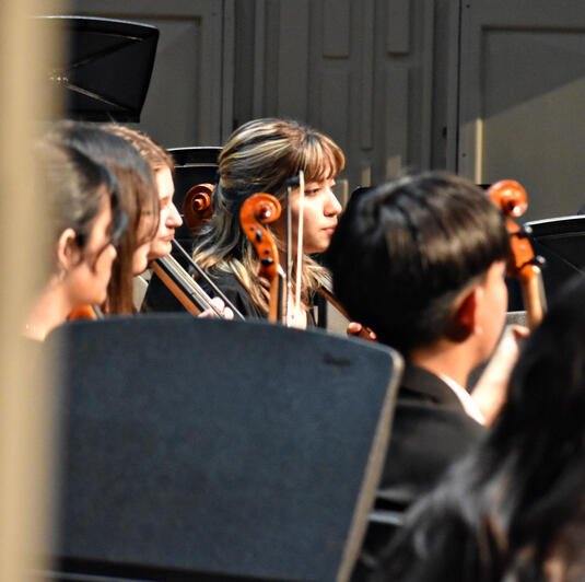 Seniors Alyssa Apostoli (left) and Mariana Acosta) play their string instruments. (Photo by Karidja Monjolo)